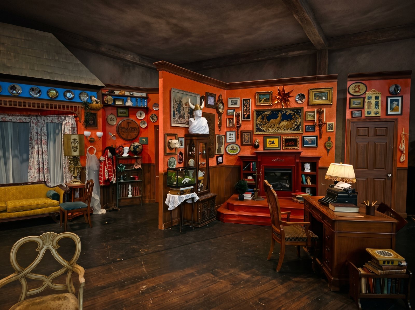 A wide view of a vintage living-room set with orange walls, a desk and a yellow couch